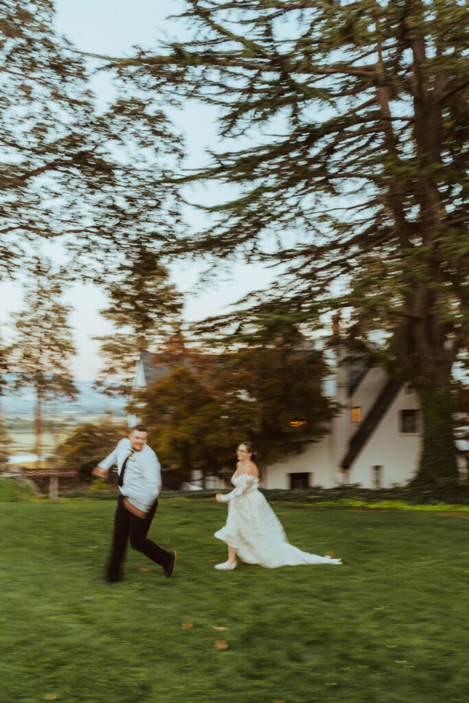 modern photo of bride and groom dancing in the grass
