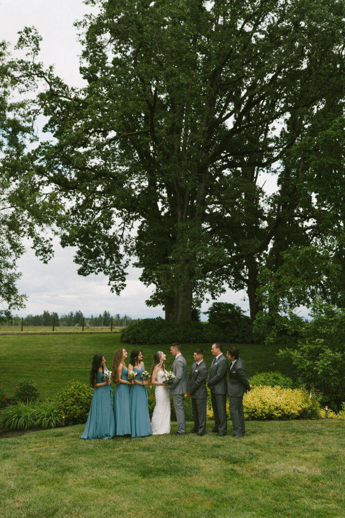 bride and groom with their bridal party at their spring wedding