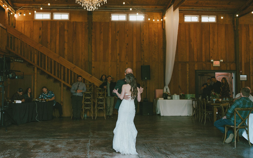bride dancing the father daughter dance at the reception