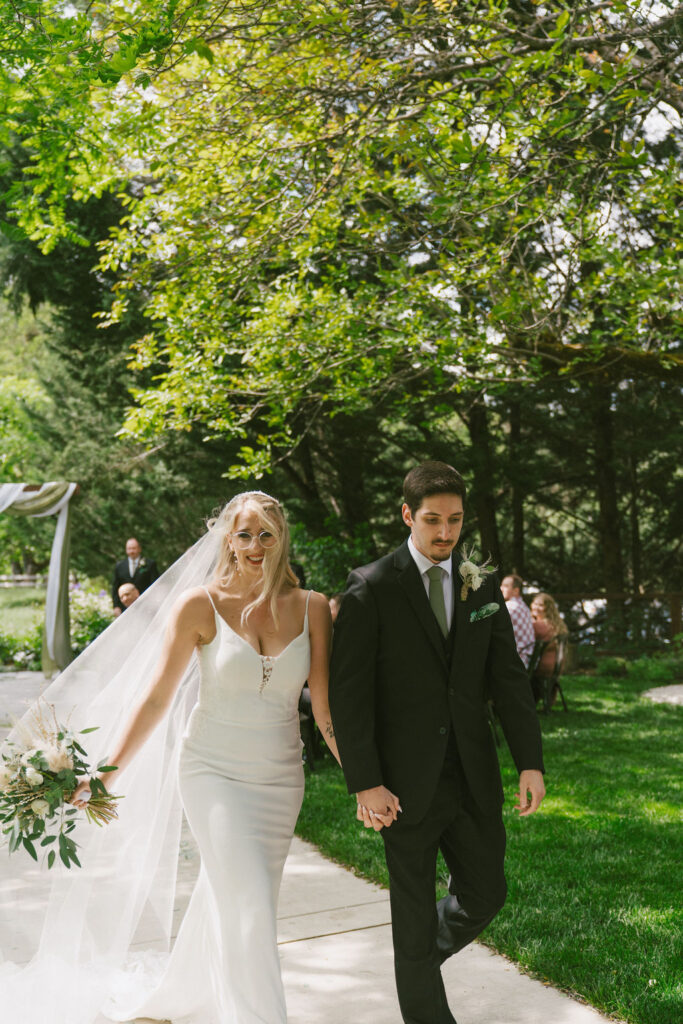 bride and groom walking down the isle