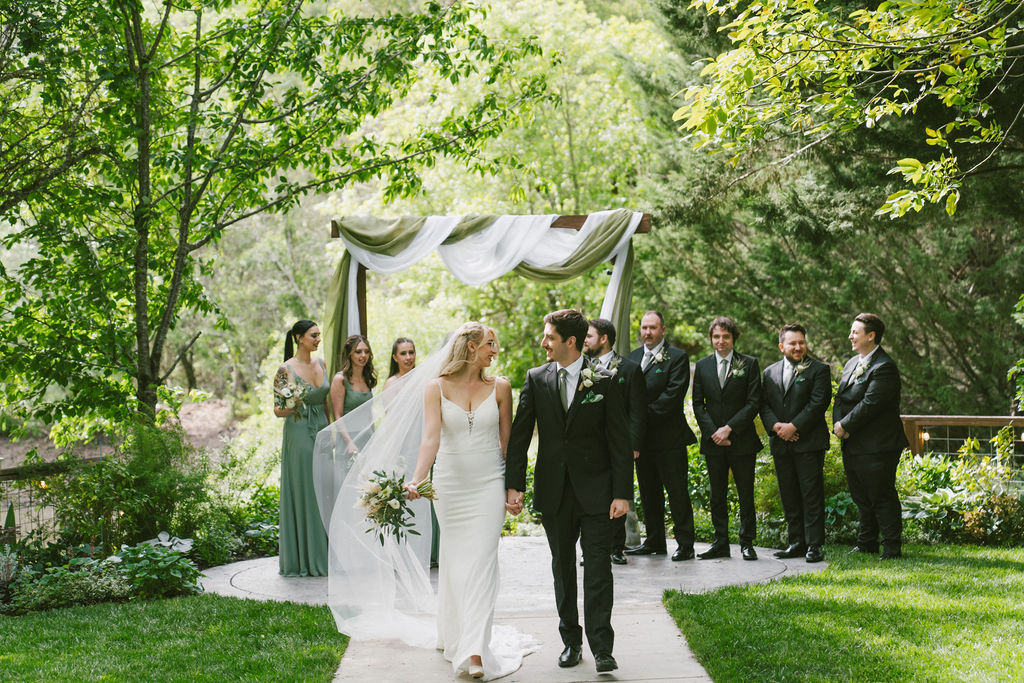 bride and groom walking down the isle as husband and wife