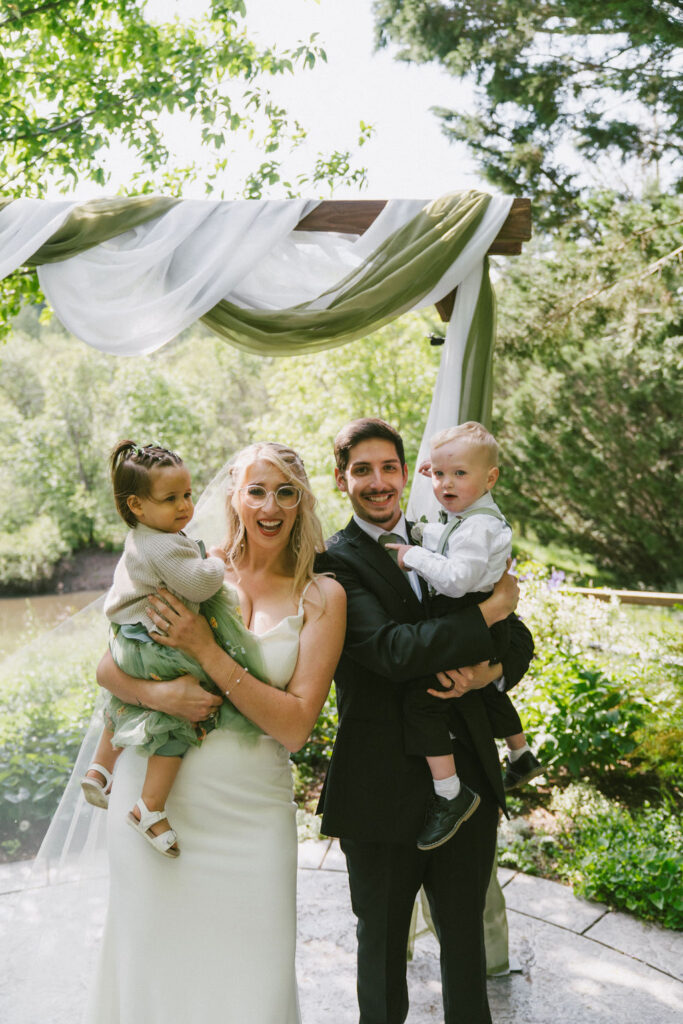 bride and groom with children 